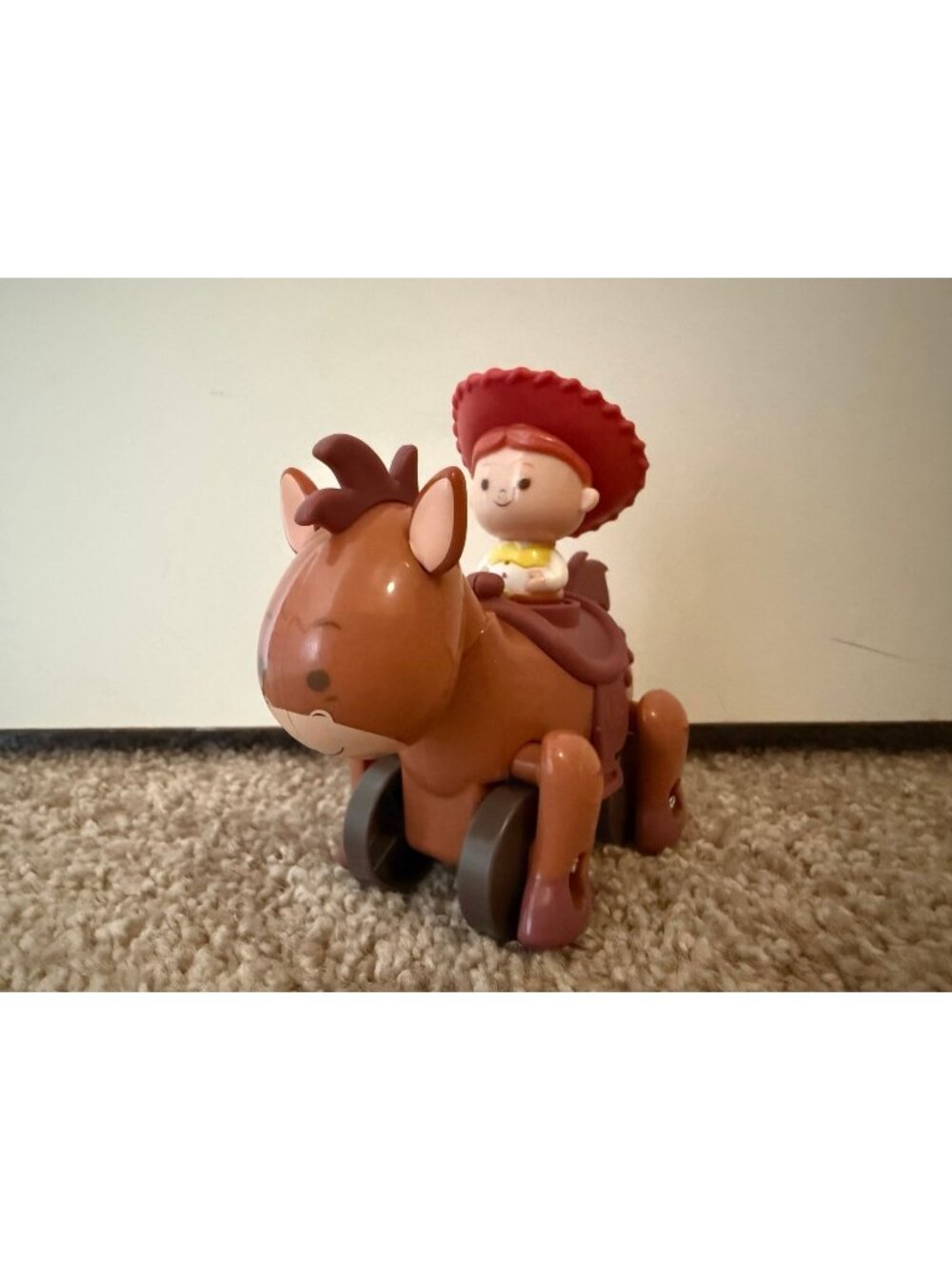 Jess on bulls eye moving car like toy (Toy Story)